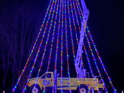Custom Exterior Landscape setting up holiday lights in Rocky Hill