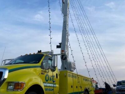 Custom Exterior Landscape setting up holiday lights in Rocky Hill