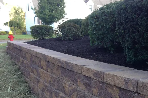 Replaced old failing wall with block retaining wall