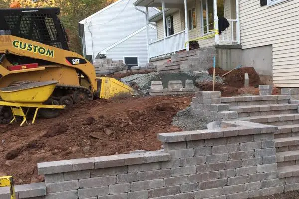 Retaining wall and staircase from driveway in Wethersfield